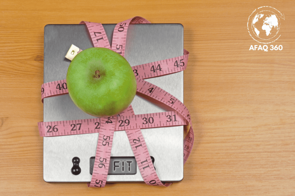 بدائل إبر التخسيس الطبيعية الآمنة ميزان مع شريط قياس وتفاحة رموز التخسيس